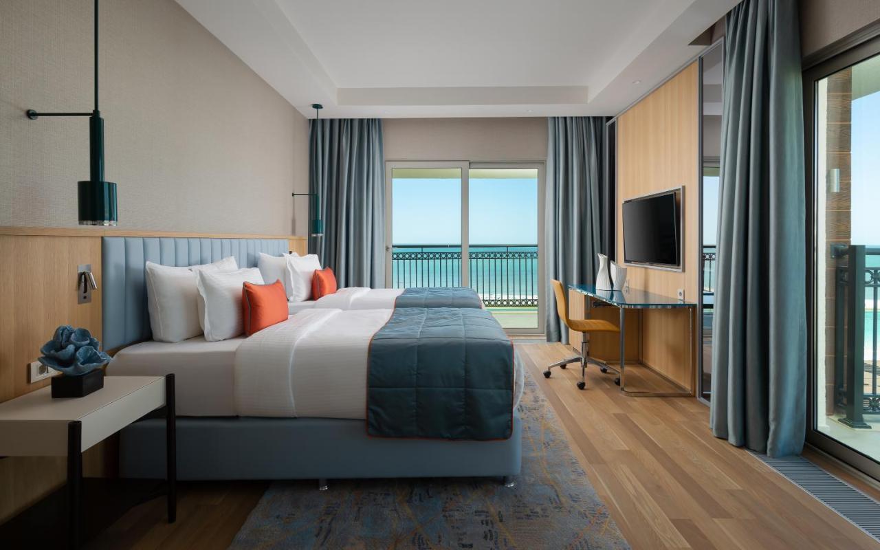 Deluxe Tweepersoonskamer met 2 Aparte Bedden en Uitzicht op Zee