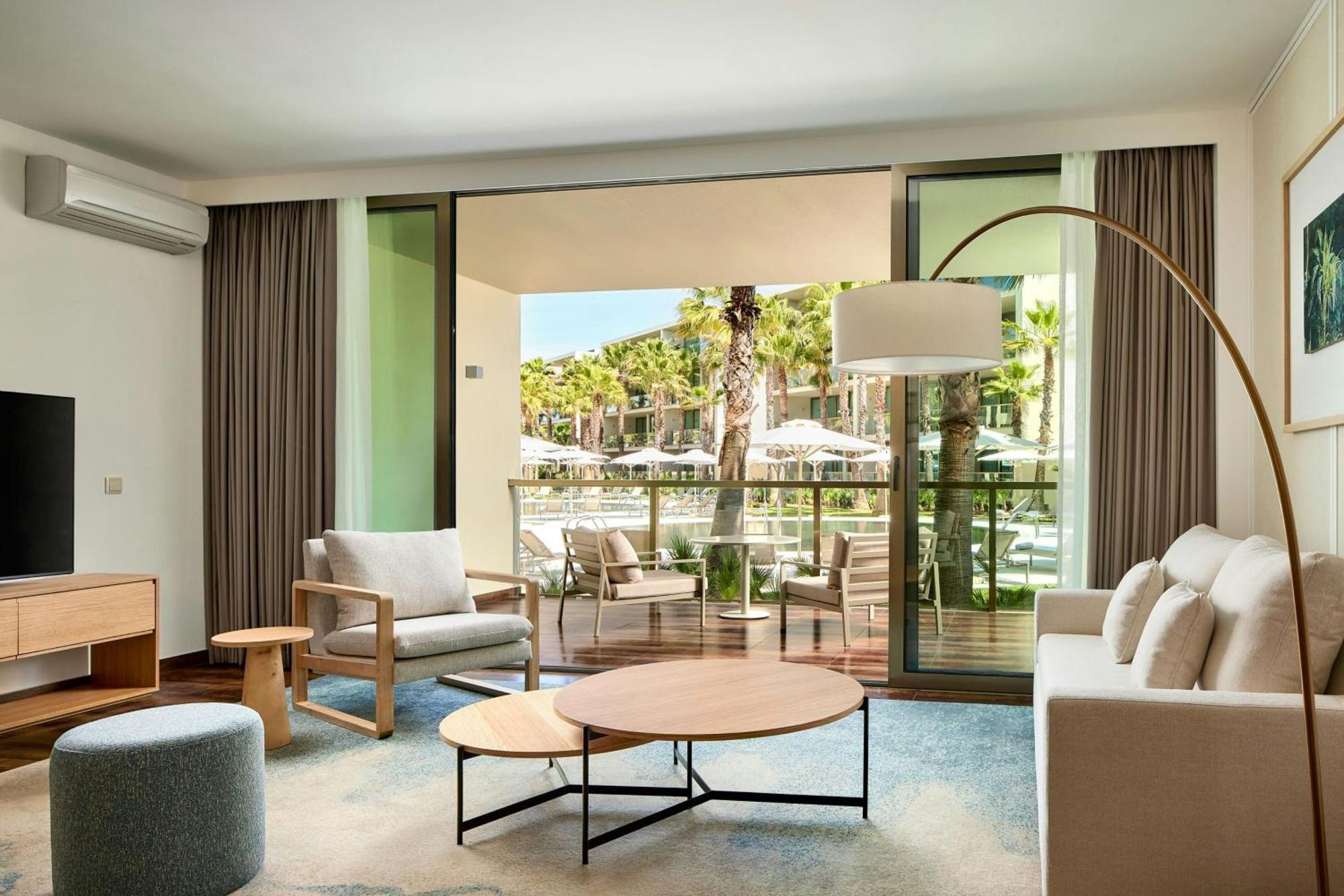 One-Bedroom King Suite Balcony Pool View,1689854891:JPEG